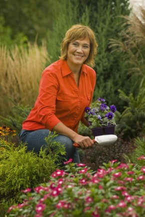 Melinda with shovel in garden