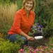 Melinda with shovel in garden